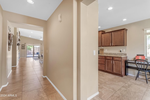 corridor featuring light tile patterned flooring