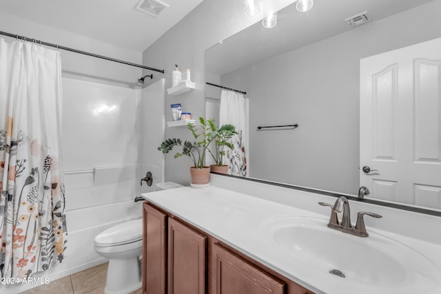 full bathroom featuring vanity, tile patterned floors, shower / bath combination with curtain, and toilet