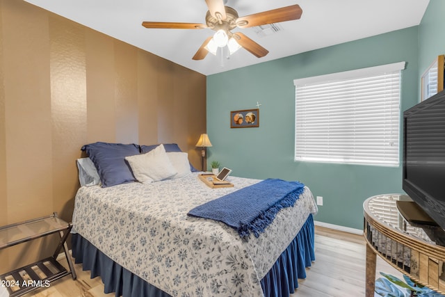 bedroom with hardwood / wood-style flooring and ceiling fan