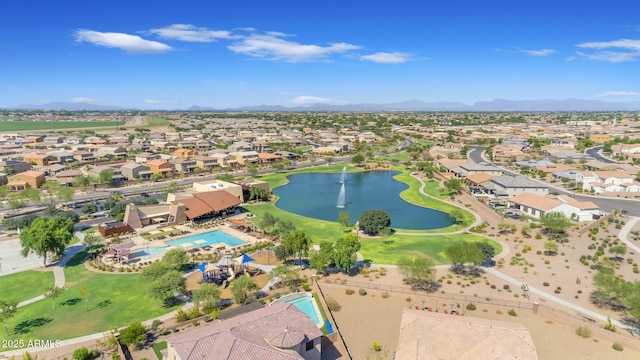 drone / aerial view featuring a water and mountain view