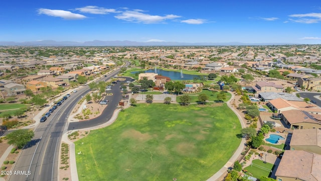 bird's eye view with a water and mountain view