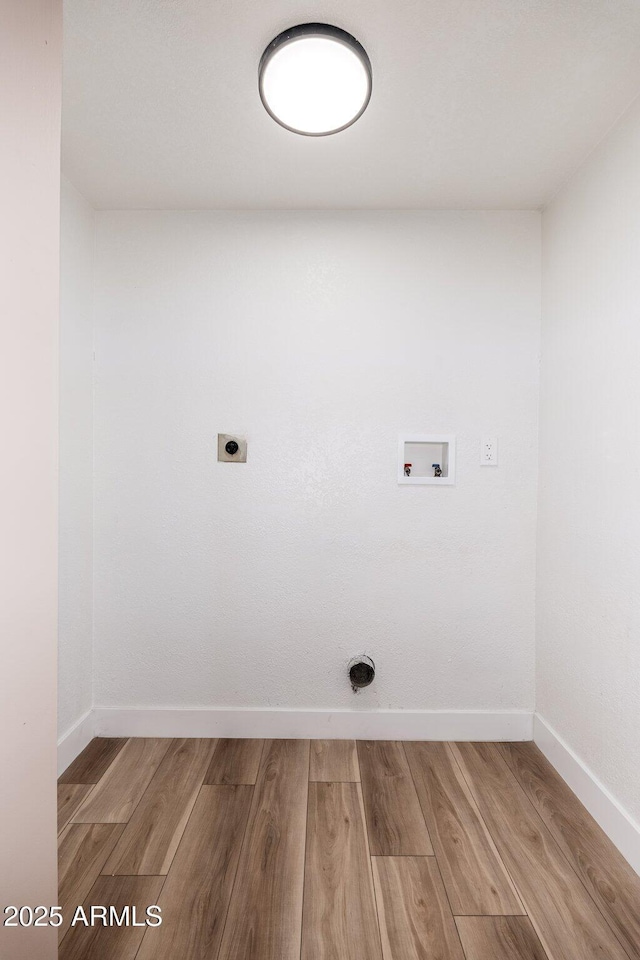 laundry area with hookup for a washing machine and hookup for an electric dryer