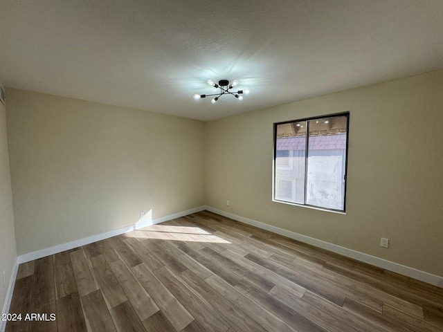 unfurnished room featuring light hardwood / wood-style floors