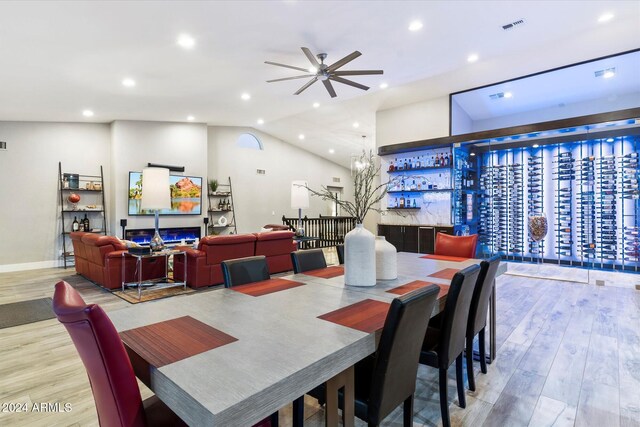 24218 N 85th St, Scottsdale, AZ 85255 - dining area featuring wood finished floors, a dry bar, ceiling fan, recessed lighting, and vaulted ceiling