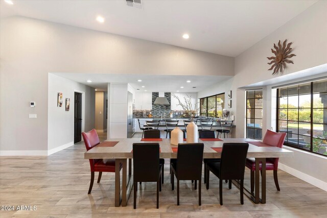 24218 N 85th St, Scottsdale, AZ 85255 - dining area featuring light wood finished floors, high vaulted ceiling, and recessed lighting