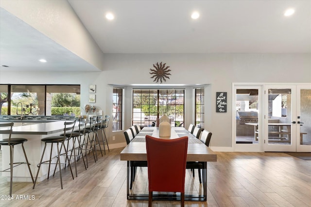 dining room with sink and light hardwood / wood-style floors