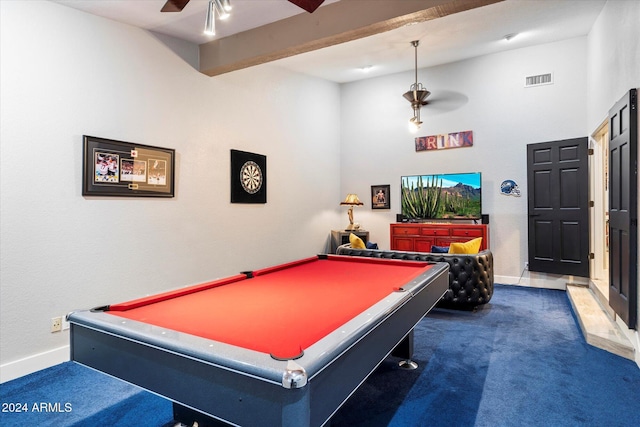 game room featuring ceiling fan, pool table, beamed ceiling, and dark colored carpet