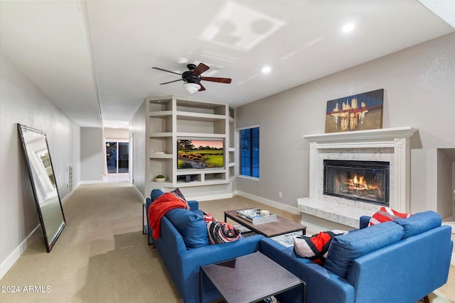 24218 N 85th St, Scottsdale, AZ 85255 - carpeted living room featuring a glass covered fireplace, ceiling fan, built in features, and recessed lighting