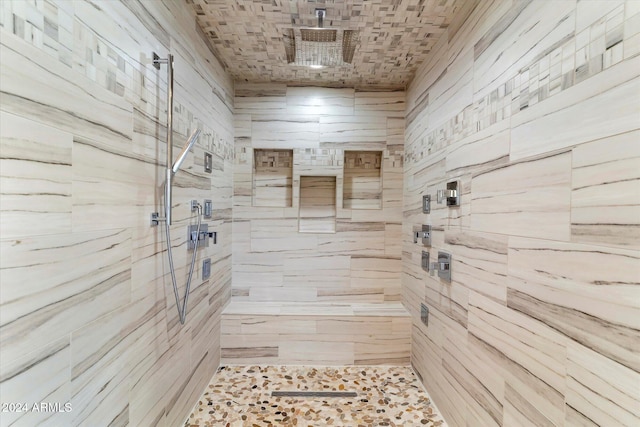 bathroom featuring tiled shower