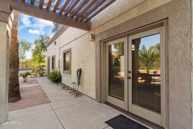 24218 N 85th St, Scottsdale, AZ 85255 - entrance to property featuring stucco siding, a pergola, and a patio area
