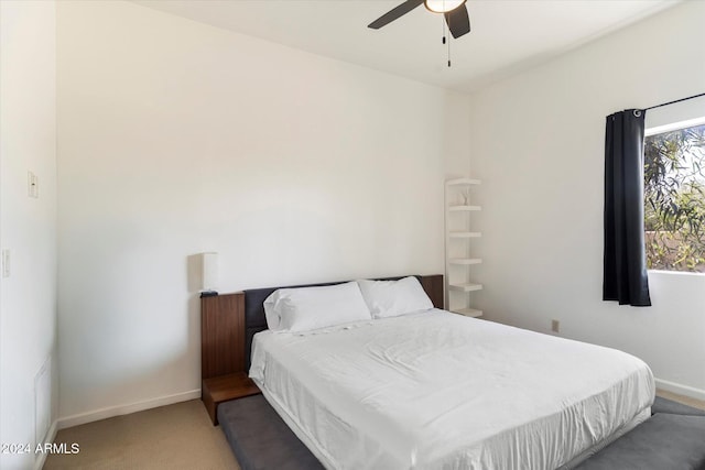 bedroom with ceiling fan and carpet floors