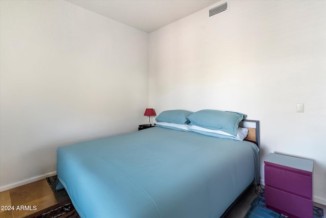 bedroom with wood-type flooring