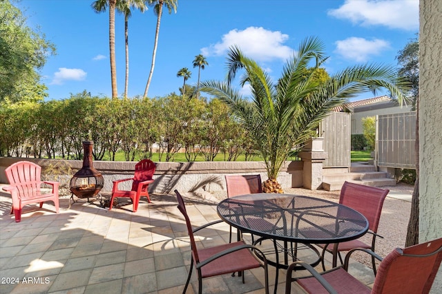 view of patio with an outdoor fire pit