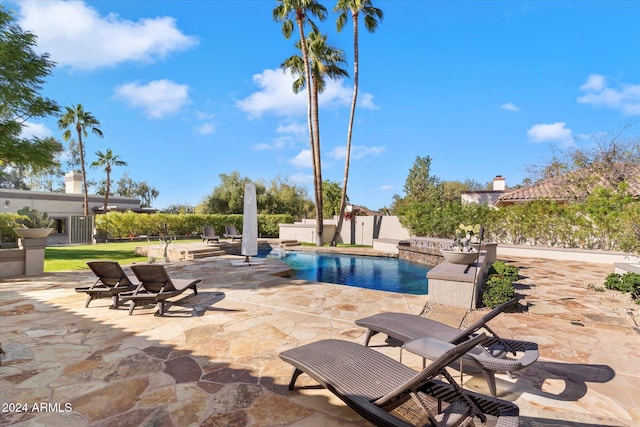 view of pool featuring a patio