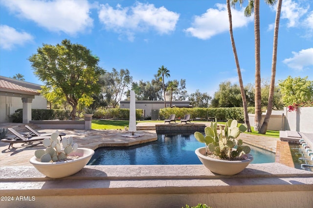 view of swimming pool with a patio area