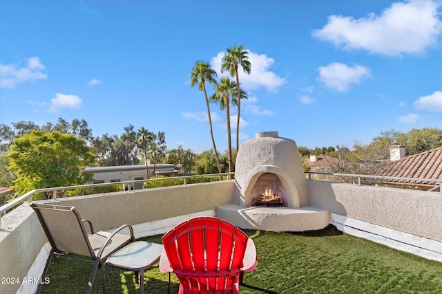 24218 N 85th St, Scottsdale, AZ 85255 - view of yard with a lit fireplace and a balcony