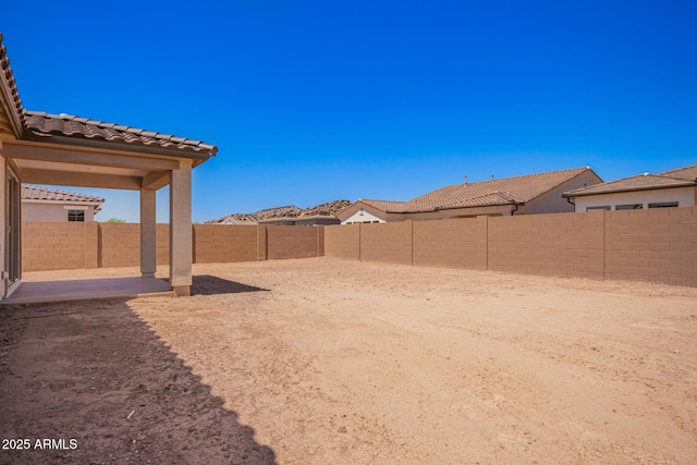 view of yard featuring a fenced backyard and a patio area