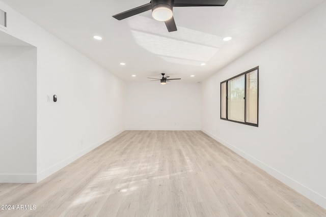 unfurnished room featuring ceiling fan and light hardwood / wood-style floors