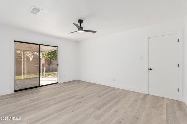 empty room with ceiling fan and light wood-type flooring