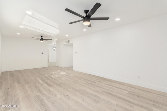 empty room featuring light hardwood / wood-style flooring and ceiling fan