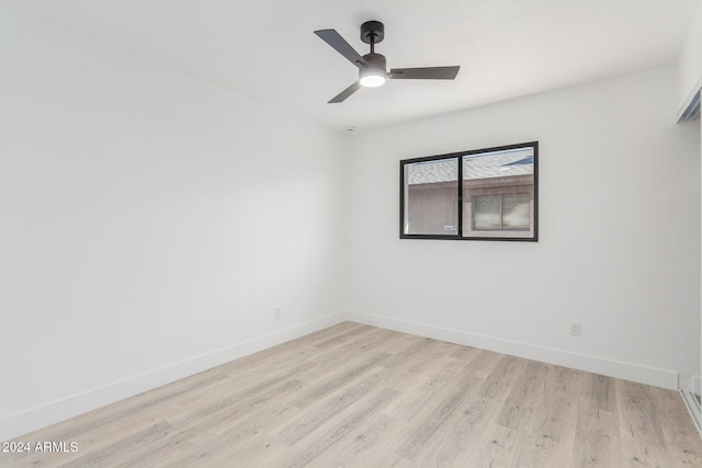 empty room featuring ceiling fan and light hardwood / wood-style floors