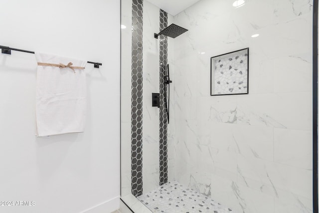 bathroom with tiled shower