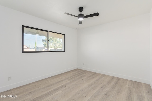 unfurnished room with ceiling fan and light hardwood / wood-style flooring