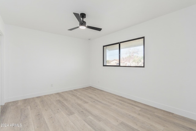 spare room featuring ceiling fan and light wood-type flooring