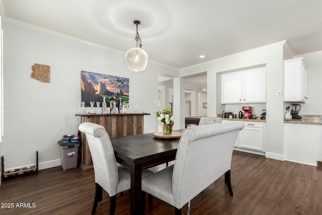 dining space with dark wood finished floors and crown molding