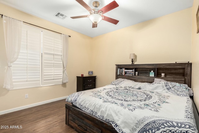 bedroom with visible vents, ceiling fan, baseboards, and wood finished floors