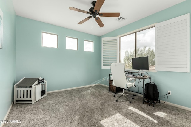 unfurnished office with visible vents, baseboards, carpet, and a ceiling fan