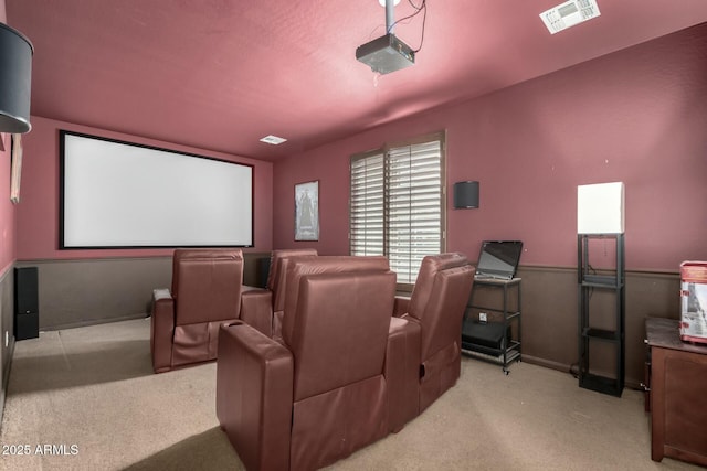 home theater featuring visible vents and carpet flooring