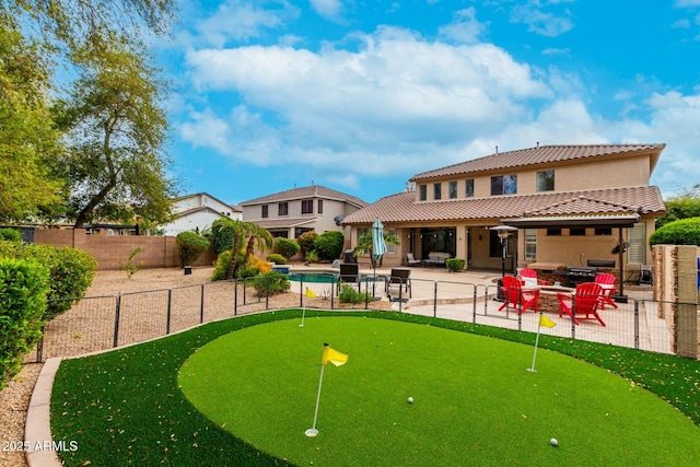 view of home's community with a patio area and fence