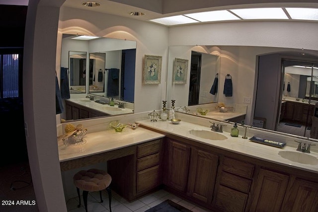 bathroom with tile patterned floors and vanity