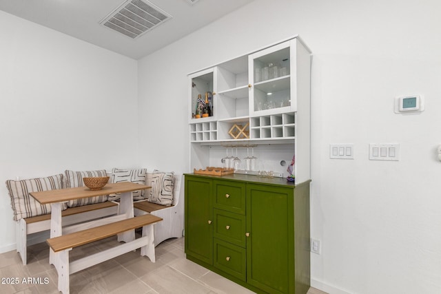 4562 S Park Grove St Unit 101, Gilbert, AZ 85297 - dining space with breakfast area and a bar