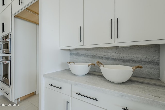 11045 N Hershey St, Surprise, AZ 85388 - detailed view of oven, double vanity, and backsplash