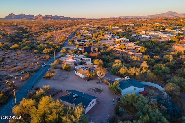 aerial view at dusk with a mountain view and a residential view