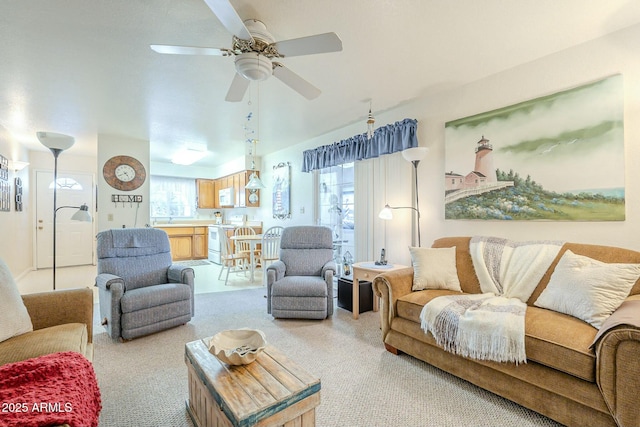 living area with carpet flooring and ceiling fan