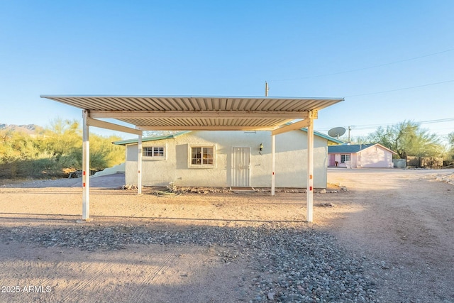 exterior space with a carport