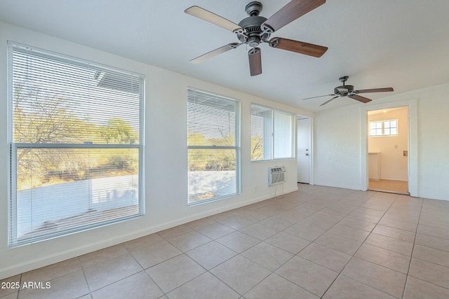 empty room with light tile patterned floors and a wall unit AC