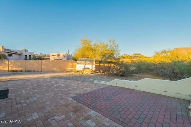 view of patio featuring fence