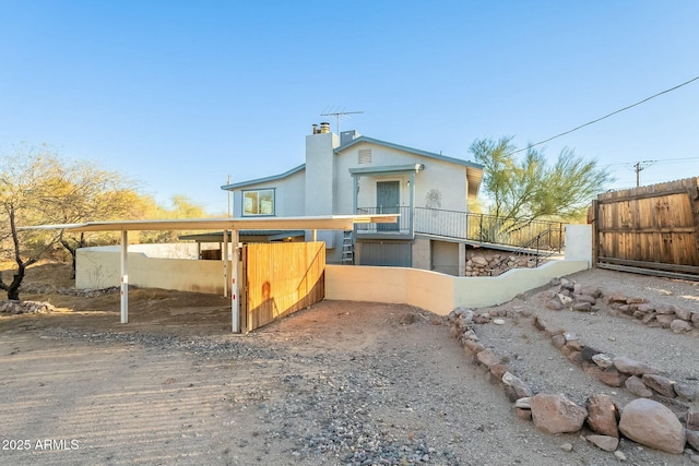 view of front of property with fence and a chimney