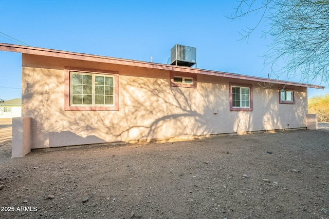 view of side of home featuring central air condition unit