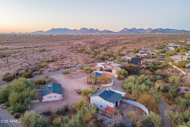 aerial view at dusk featuring a residential view and a mountain view