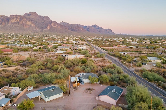 aerial view at dusk with a residential view and a mountain view