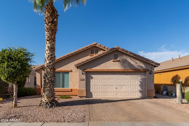 single story home featuring a garage