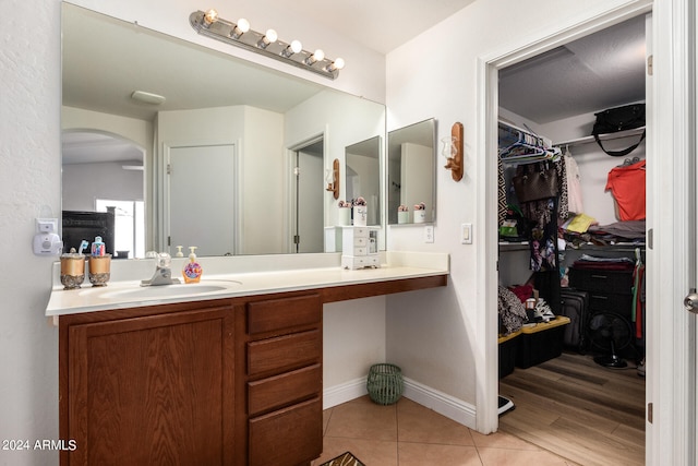 bathroom with vanity and wood-type flooring