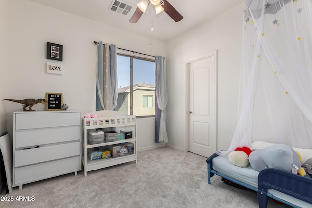 bedroom featuring ceiling fan and light colored carpet