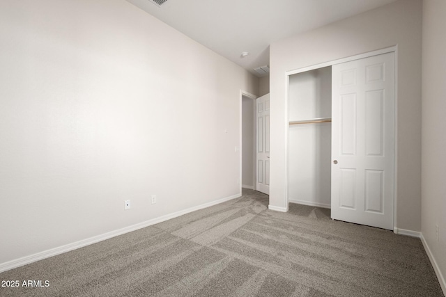 unfurnished bedroom featuring a closet and carpet