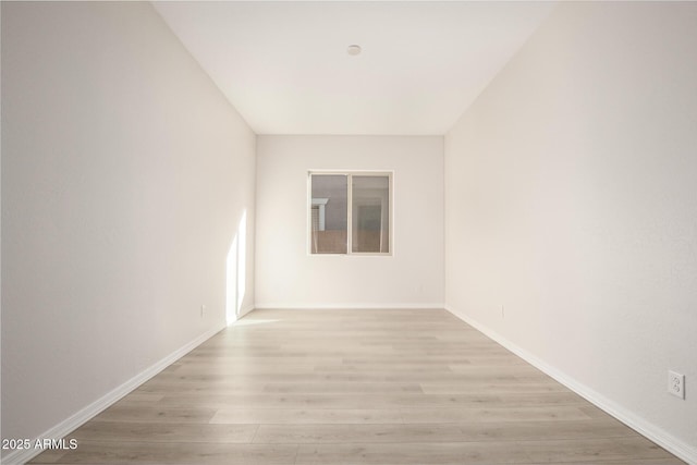 spare room featuring light wood-type flooring